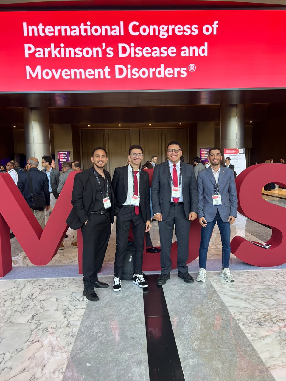 Ahmed Negida with a group of his students at the MDS Congress 2026